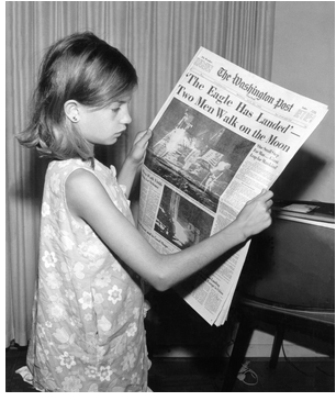 A girl holds The Washington Post