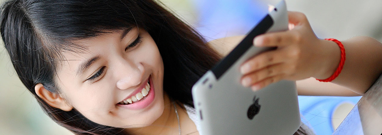 a girl with an ipad