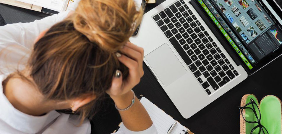 Frustrated woman at computer Frustrated woman at computer