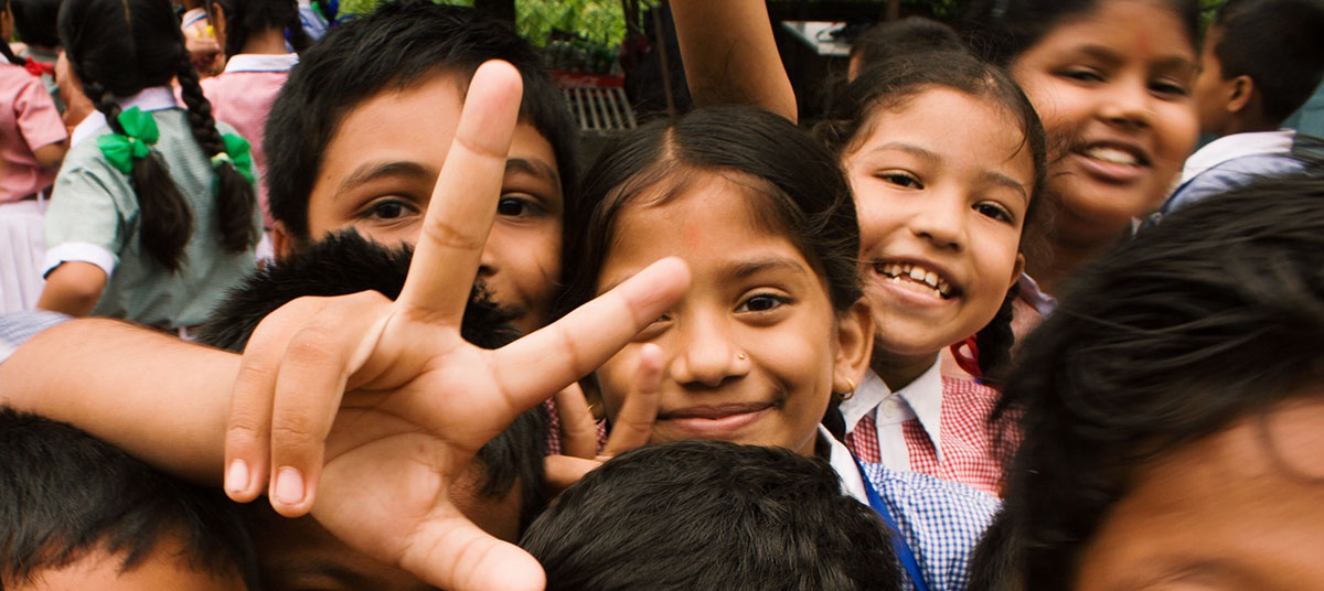 Many children smiling