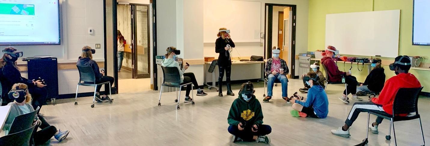 A group of people in a room
Description automatically generated